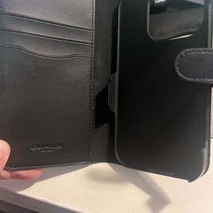 Coach phone case, like new! I used it for my Iphone 13